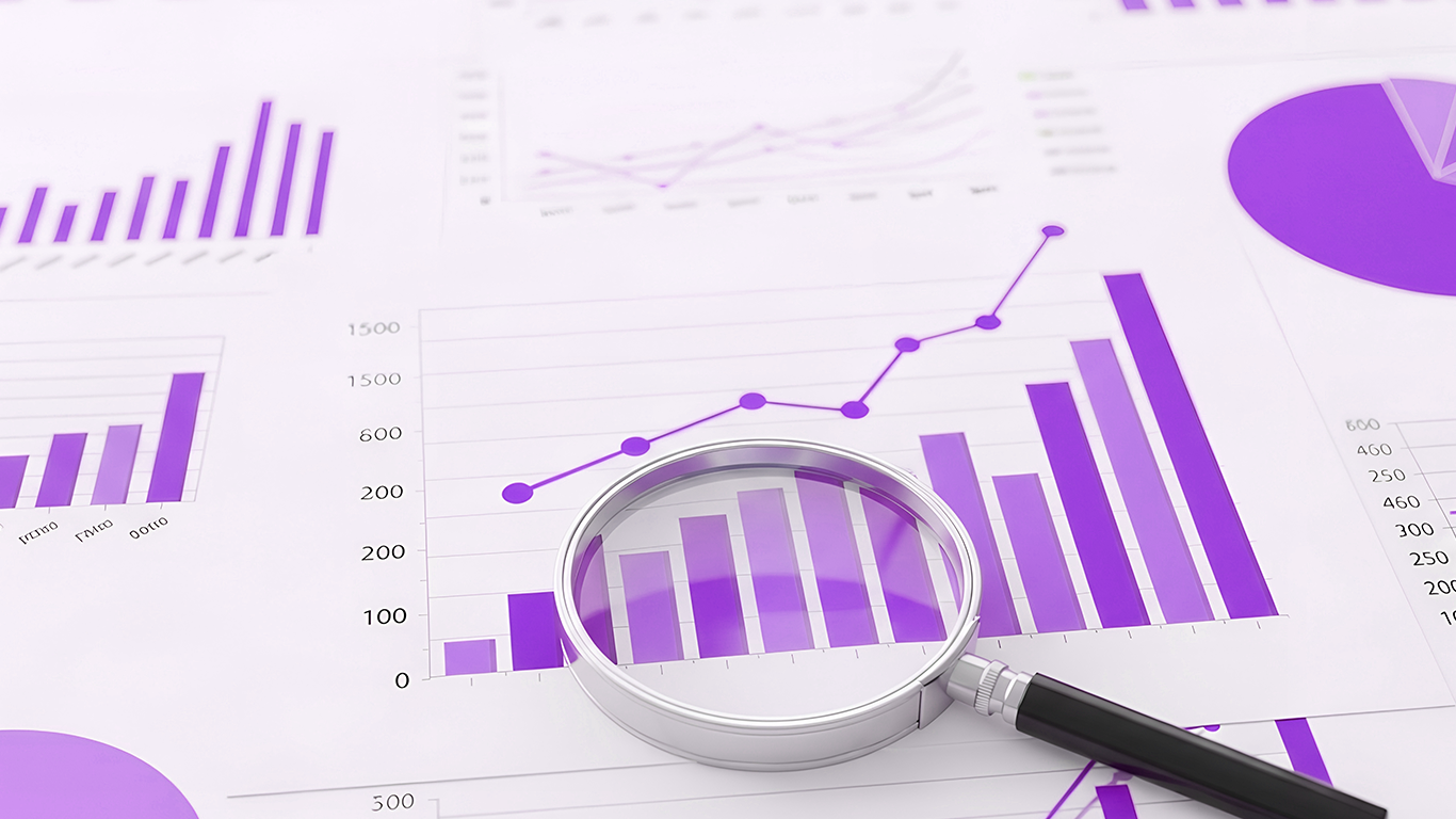 A bar-chart dashboard with a magnifying glass examining the data.